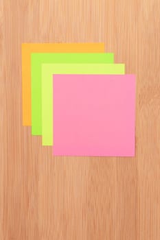 Colored Sticky Notes with Copyspace Pinned to the Wooden Message Board. To Do List Reminder in Office. Blank Memo Sticker at Work - Template. Empty Checklist - Mockup