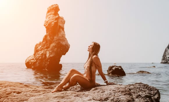 Woman summer sea. Happy woman swimming with inflatable donut on the beach in summer sunny day, surrounded by volcanic mountains. Summer vacation concept