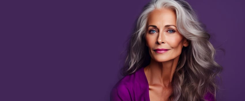 Elegant, smiling, elderly, chic, woman with gray long hair and perfect skin, on a purple background, banner. Advertising of cosmetic products, spa treatments, shampoos and hair care products, dentistry and medicine, perfumes and cosmetology for women