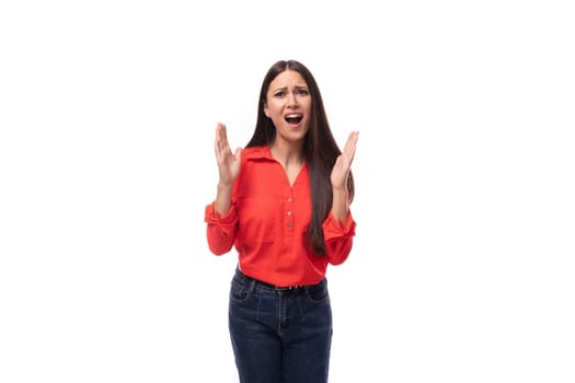young energetic active brunette assistant woman dressed in a red blouse on a white background with copy space.