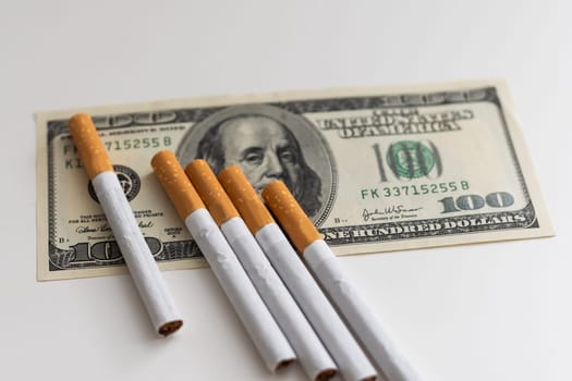 Classic cigarettes are on the hundred dollar bills of the United States. High quality photo