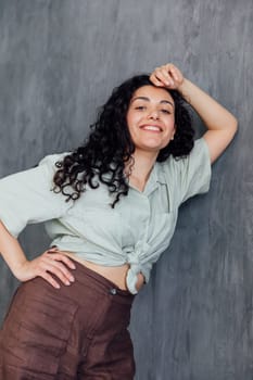 Portrait of a fashionable woman with black curly hair