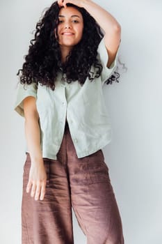 young woman with black curly hair