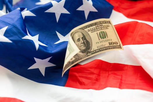 American flag and banknotes USD currency money. High quality photo