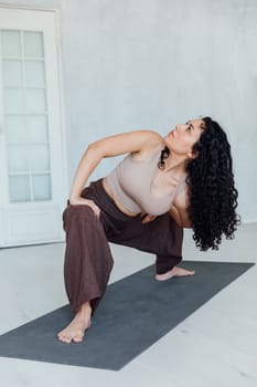 Female yogi doing asana pose exercises