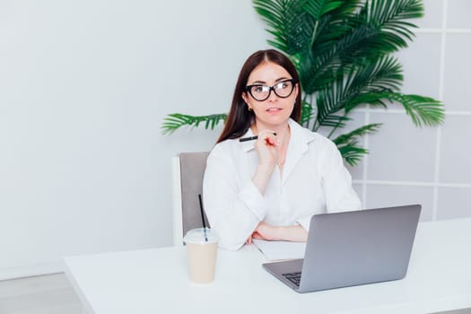 woman working online at computer in office