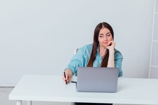 woman working online at computer in office