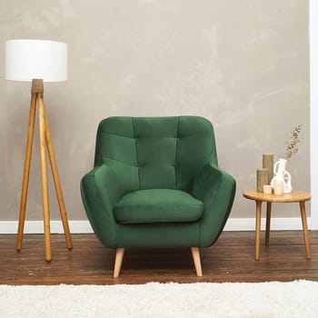 Modern green fabric armchair with wooden legs, front view. furniture, interior, home design
