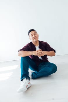 Portrait of asian man in white room