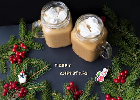 marshmellou hot cocoa trees in the background. The inscription Merry Christmas.