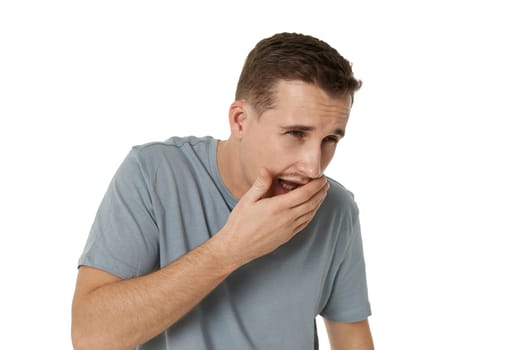 caucasian man suffers pain in throat and coughing on white background