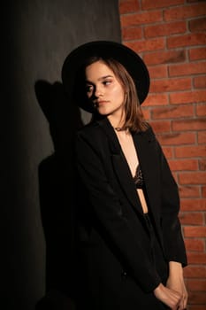 Portrait of a beautiful woman in black clothes at night