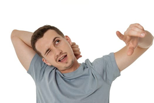 happy guy looking up and pointing up on white studio background