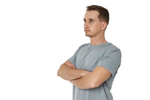 profile of man wears t-shirt holds hands crossed isolated on white background