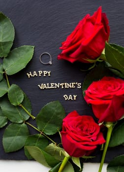 closeup inscription Happy Valentine on a black background