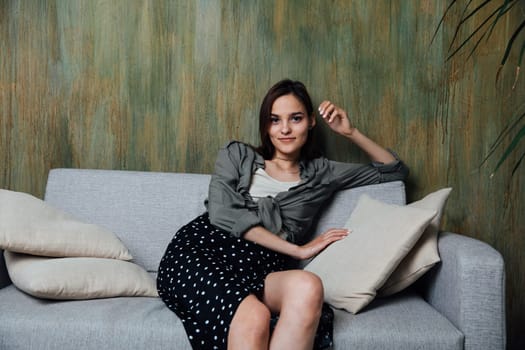 Portrait of a beautiful woman on an office sofa at home