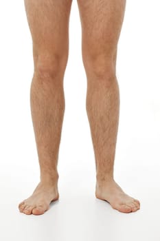 Barefoot male legs on white background. Body care concept.
