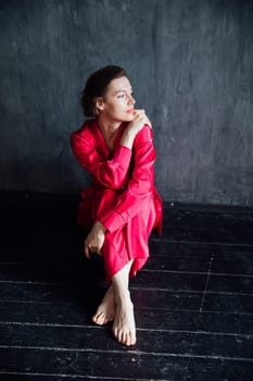 Beautiful woman in 40 years old in red silk pajamas