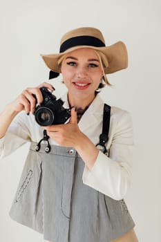 Beautiful woman photographer with vintage film camera