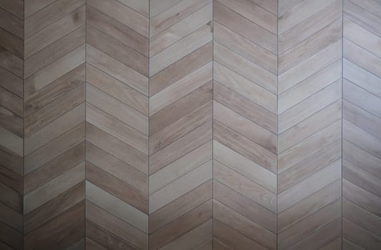 Wooden floor with parquet in shape of tree closeup background. Laying laminates concept