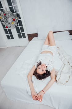woman in pajamas sleeping in bedroom on bed