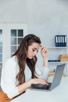 woman working at computer office office online