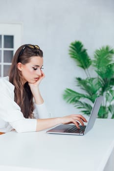 woman with laptop learning to work online