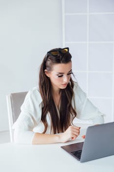 woman with laptop learning to work online