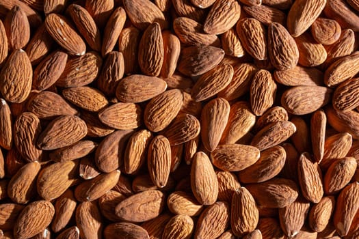 Scattered Almonds. Background from Almond Nuts. Natural High-Calorie Snacks