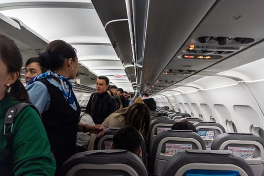 Inside of old Airbus A-320 while people are boarding at Moscow, Russia - September 29, 2022