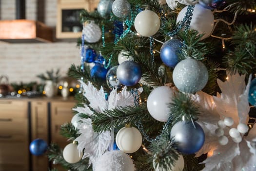 Christmas tree with blue and white toys in the interior.Christmas card
