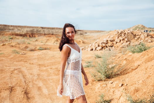 Portrait of tanned brunette woman outdoors