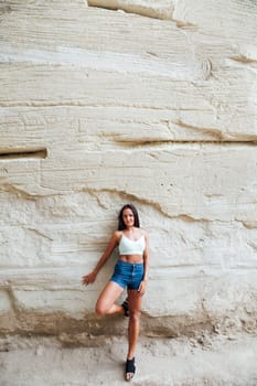 Portrait of tanned brunette woman outdoors