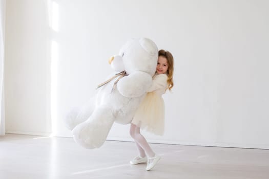 girl with toy teddy bear gift