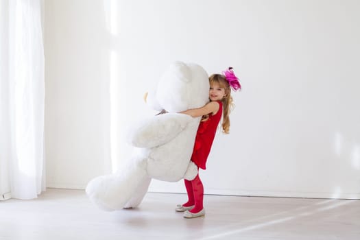 girl with toy teddy bear gift