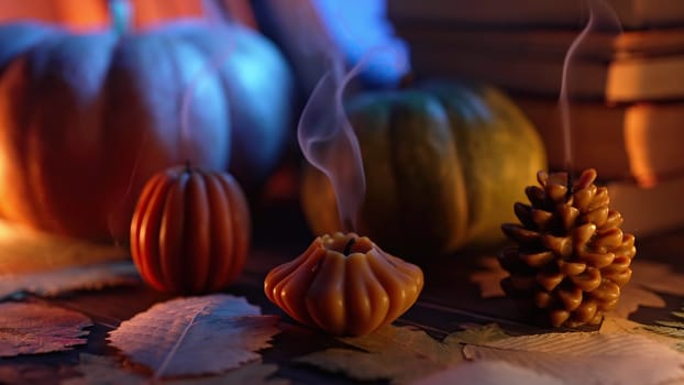 Melancholic beauty of autumn, extinguished pumpkins, cone candles on windowsill, wistful charm of fall season, touch of poetic ambience, autumnal nostalgia and reflection.