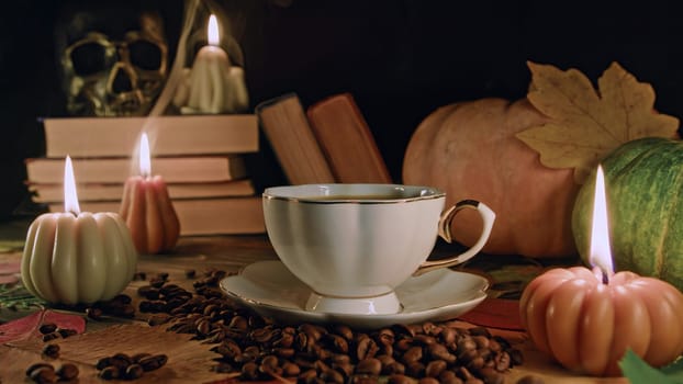 Porcelain coffee cup among pumpkin candles. Autumn-themed content, cafe promotions or visual storytelling that exudes comfort. Touch of intimacy, tranquil and inviting hygge atmosphere.