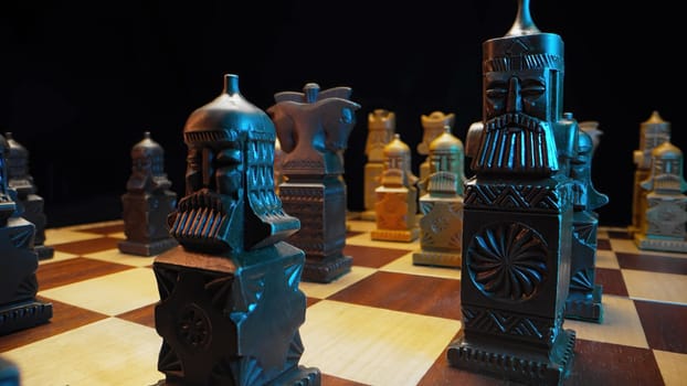 Slavic old styled chess pieces on wooden chessboard before party competition. Board strategy game. Teamwork, success business, intelligence sport concept. Slider macro shot. High quality