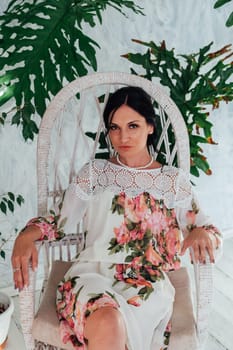 beautiful brunette woman in a dress with flowers