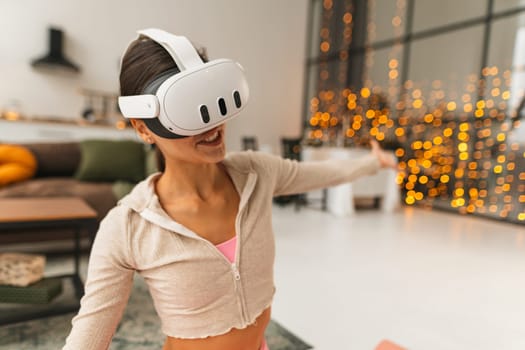 A trainer offers virtual fitness sessions at home through a virtual reality headset during the Christmas festivities. High quality photo