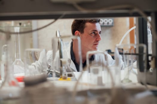 scientist conducts experiments with liquids in the medical laboratory