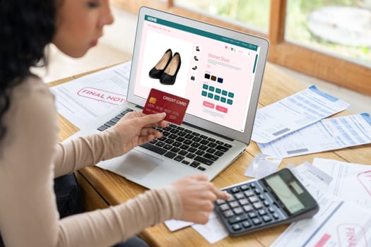 Woman shopping online on internet marketplace browsing for sale items for modern lifestyle and use credit card for online payment from wallet protected by crucial cyber security software