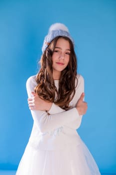 fashionable girl in a winter snow cap