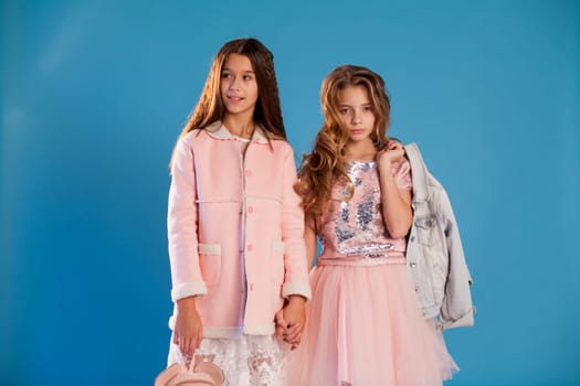 Two girls school girlfriends in white pink dresses