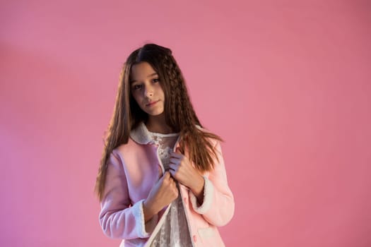 Portrait of a girl in a white pink dress