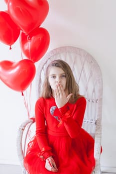 Little girl with red balloons Valentine's Day