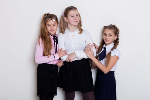 schoolgirl girls standing at the school board in class