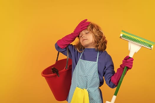 Child mopping house, cleaning home. Detergents and cleaning accessories. Cleaning service. Little boy housekeeping