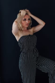 Portrait of a beautiful blonde woman in striped clothes