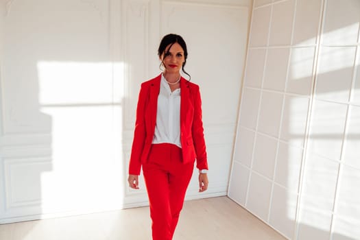 brunette woman stands by white background